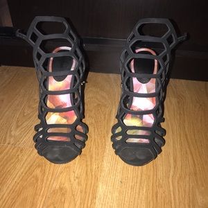 Black cage style. Peep toe heel.